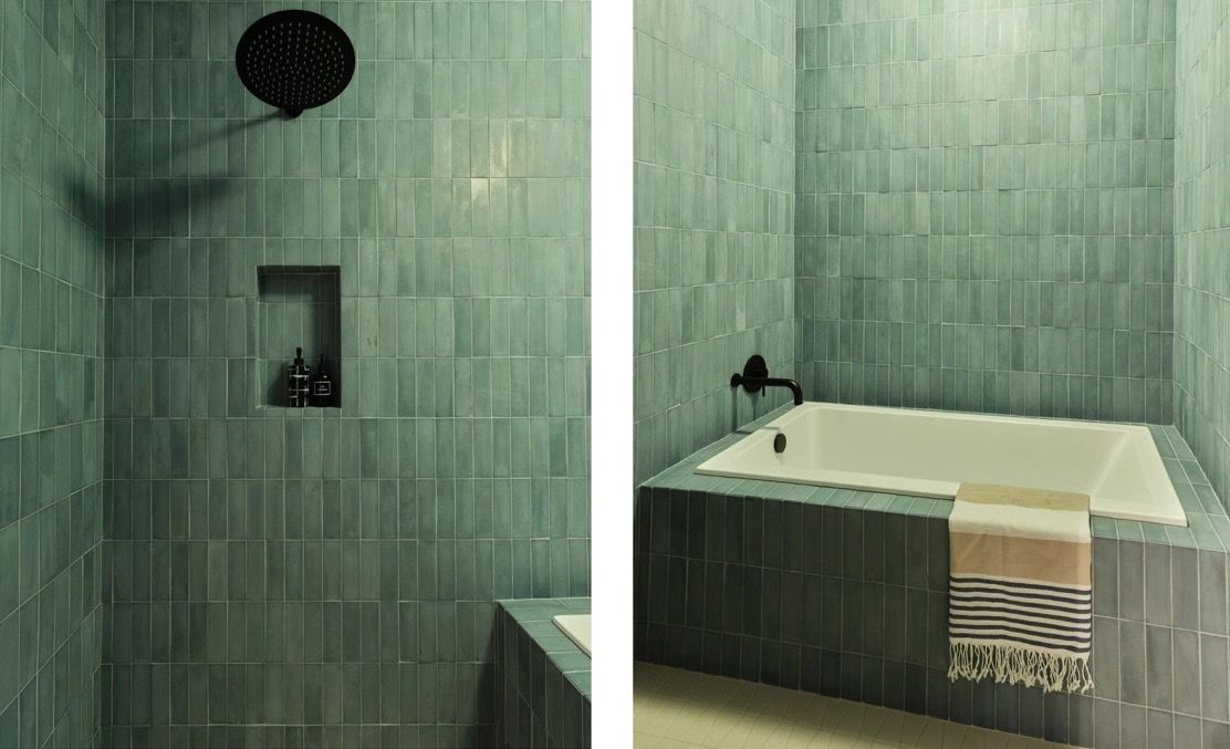 Moss-green tiled shower and soaking tub