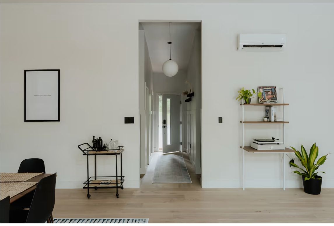 Hallway with bar cart and a view down the corridor